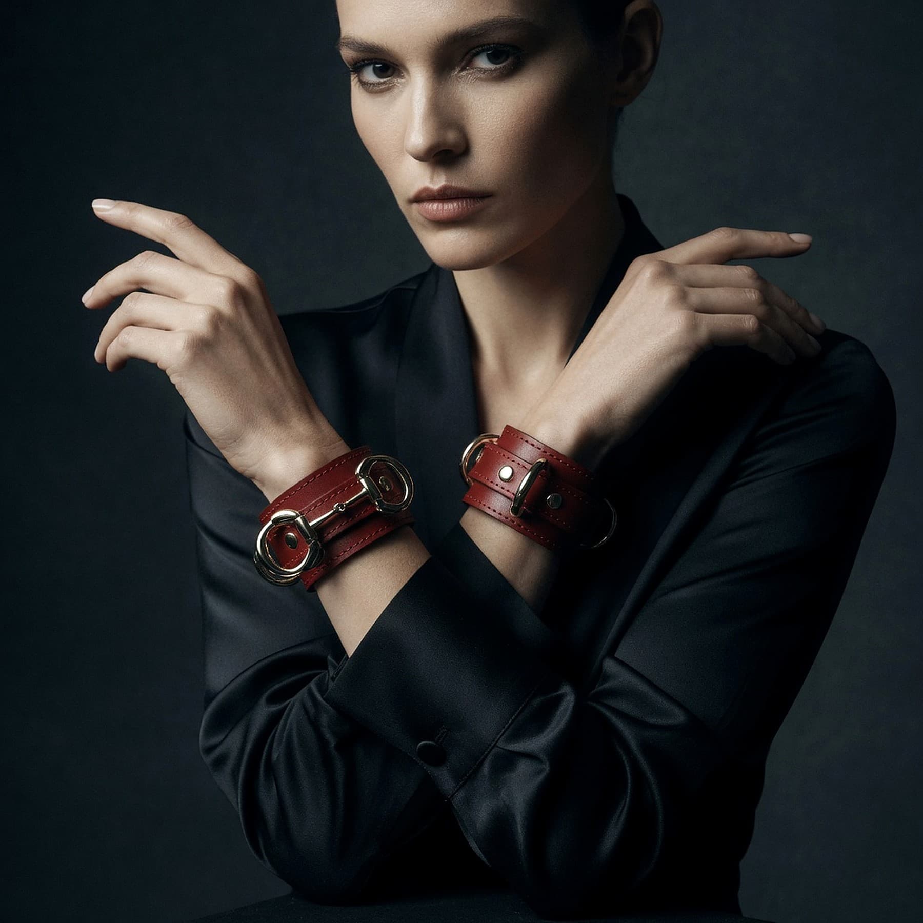 Hand-finished black leather cuffs with solid brass hardware, made by Tannoir